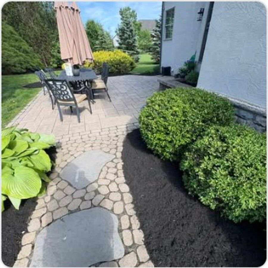Flagstone path through a mulch bed