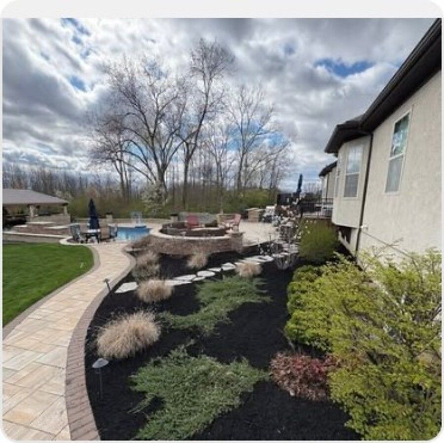 Stone patio and fire pit seating area